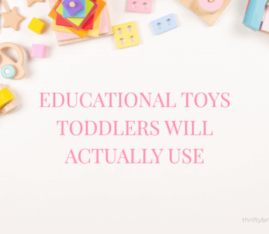Pink flat lay of educational toys for toddlers. Christmas and birthday gift ideas including wooden toys, magnetic tiles, stacking stones, balance bike, and Montessori toys.